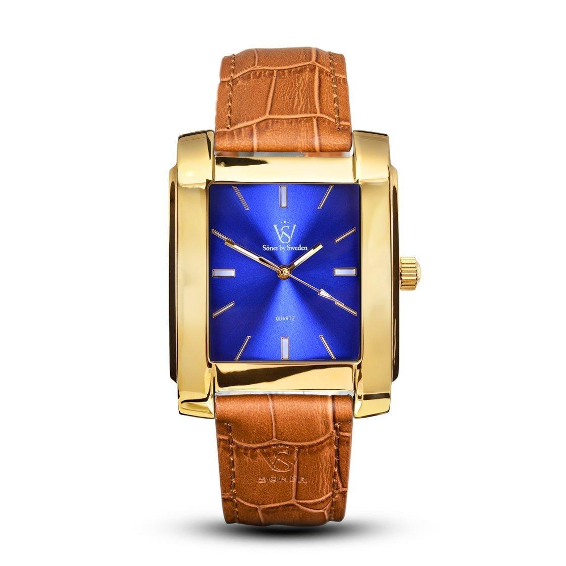 Rectangular gold Legacy Afable watch with a polished finish, vibrant blue sunburst dial, minimalist hour markers, and a light brown crocodile-embossed leather strap.
