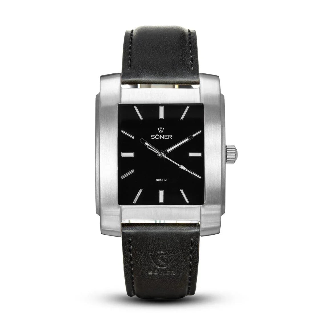 Legacy Basilica rectangular watch with a brushed stainless steel case, black dial, silver-tone markers, and a smooth black leather strap.