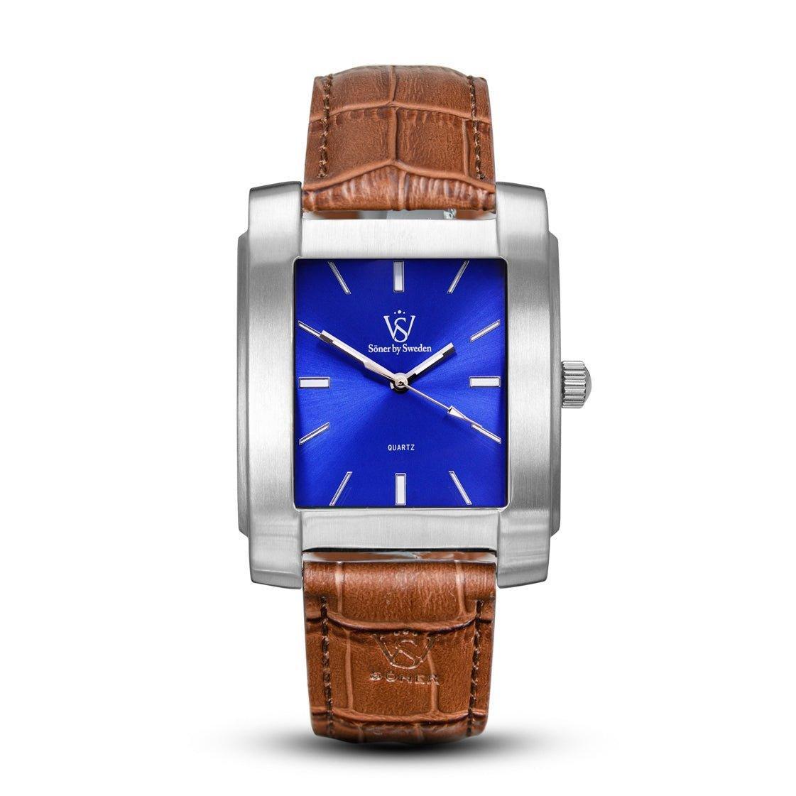 Rectangular brushed stainless steel Legacy Majorca watch with a vivid blue dial, minimalist silver markers, and a brown leather strap embossed with the Söner logo.