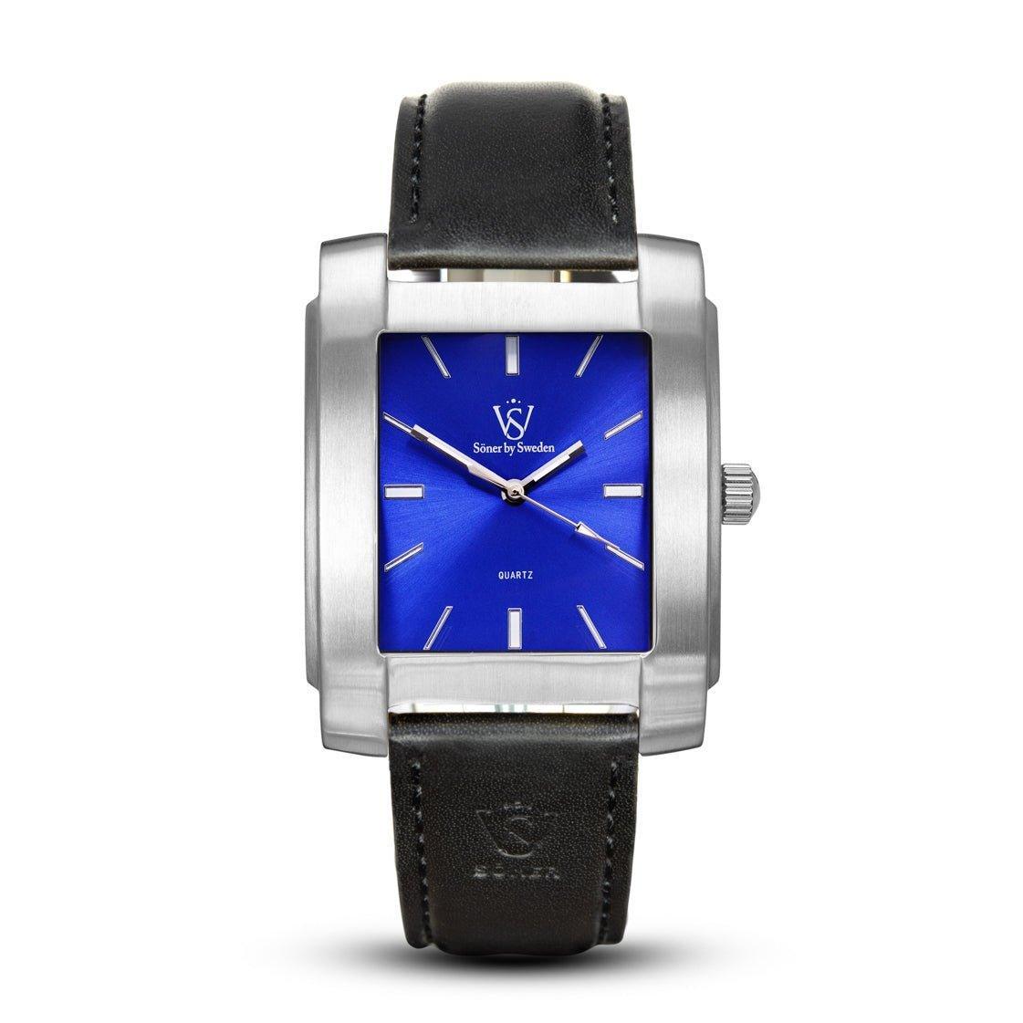 Legacy Majorca rectangular watch with a brushed stainless steel case, striking blue dial, minimalist indices, and a black leather strap embossed with the Söner logo.
