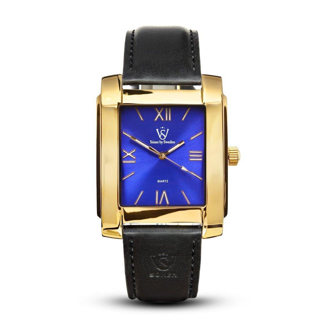 The Legacy Mercado rectangular gold watch from Söner features a blue face adorned with Roman numerals and gold hands. It is complemented by a black leather strap with embossed detailing and includes a subtle logo on the face. This watch comes with a 3-year battery.