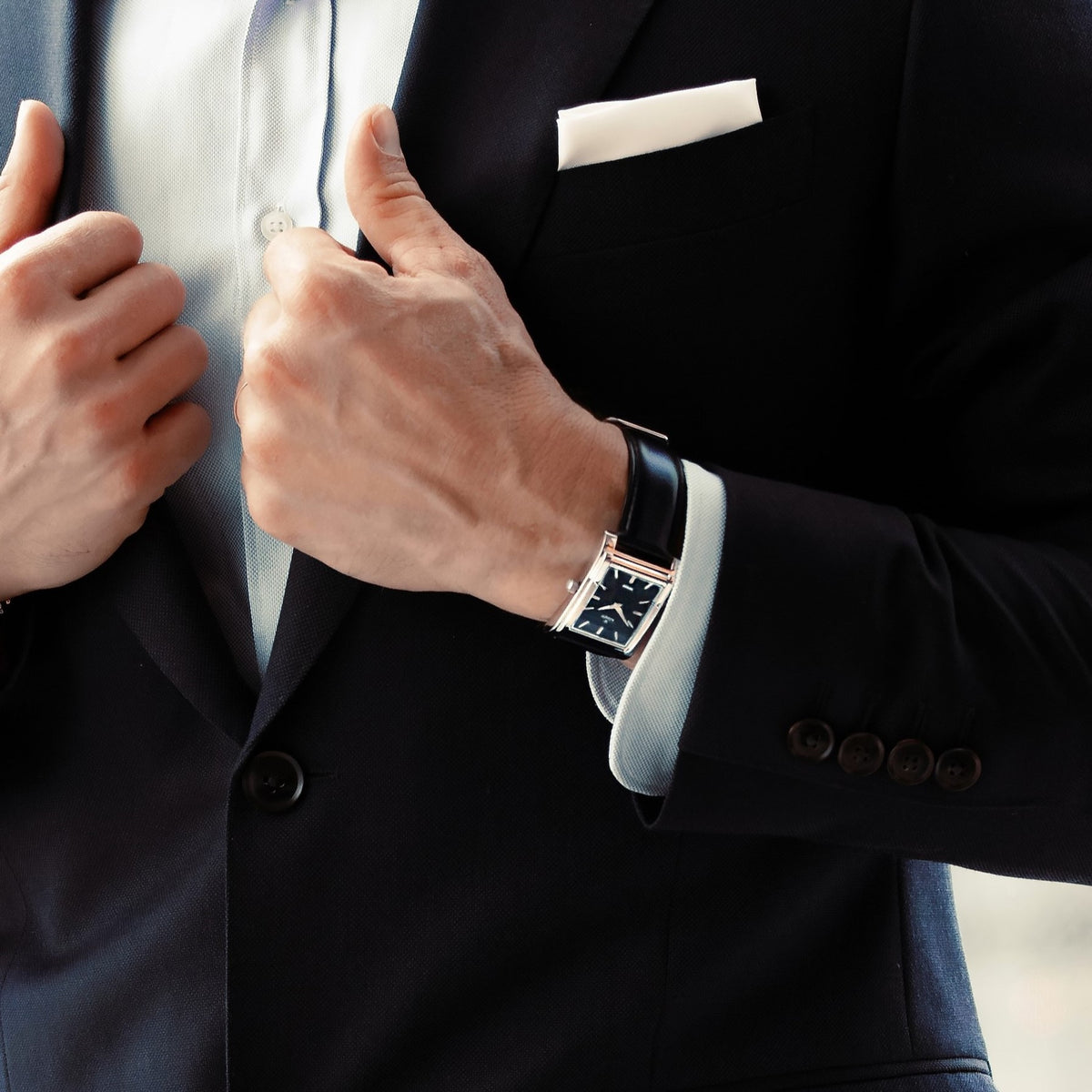 Stockholm, a rectangular watch in polished steel with a black dial