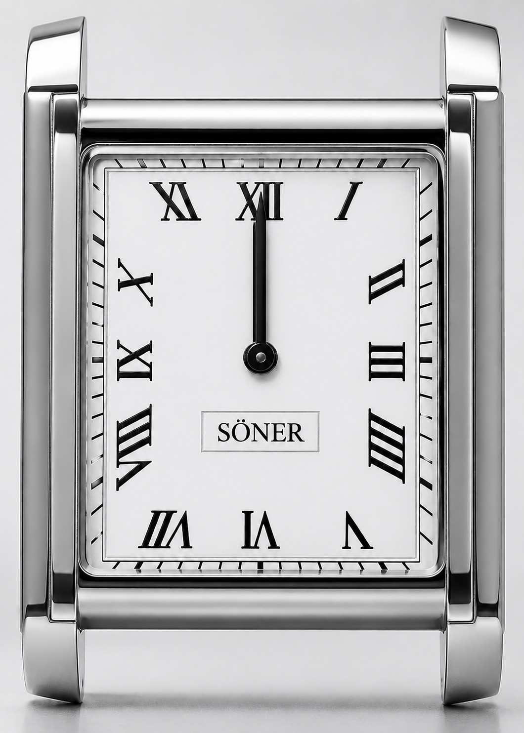 A silver square desk clock with black Roman numerals, black hands pointing to 12, and the word SÖNER on the white face. The clock features a shiny metallic frame and a minimalist design inspired by classic Art Deco watch aesthetics.