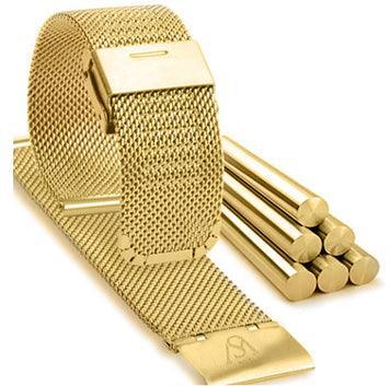 A HERITAGE Au 22mm gold mesh watch strap is displayed beside several gold bars stacked in a pyramid. The items are set against a white background, highlighting their shiny metallic texture.