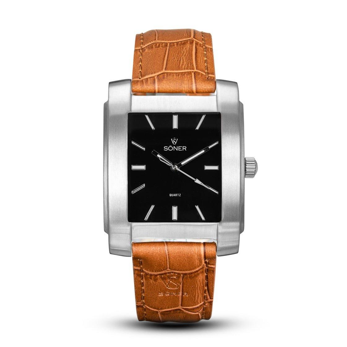 Introducing the Legacy Basilica, a three-year battery timepiece that radiates timeless elegance. It features a rectangular black dial accented with silver hour markers and hands, framed by a sophisticated silver casing. Complementing its classic design is a brown leather strap adorned with an exquisite crocodile pattern.