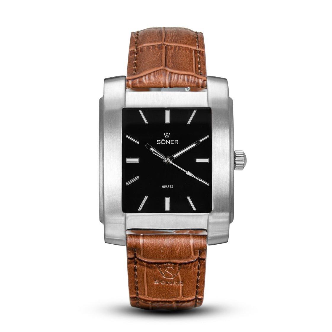 The Legacy Basilica from Söner features a men's square design with a silver metal case and black face, paired with a brown leather strap detailed with stitching. This elegant timepiece showcases minimalist white hour markers and hands, with the Söner brand name elegantly displayed on the dial. Additionally, it includes a 3-year battery for lasting performance.