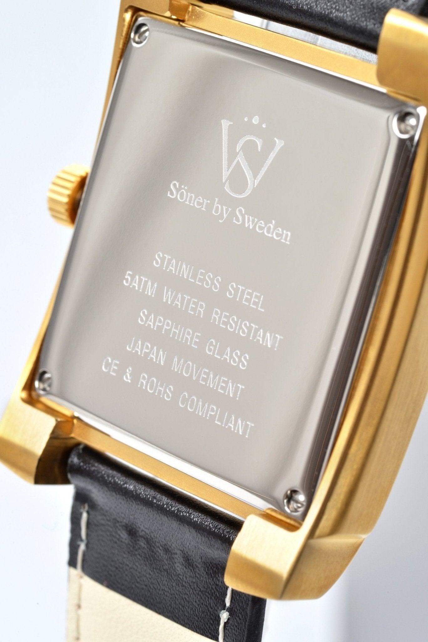 Close-up of the back of a square watch from Söner, specifically the Legacy Bella (3-year Battery), featuring a gold-tone case and black leather strap. The engraving highlights its stainless steel build, 5ATM water resistance, sapphire glass, Japan movement, and CE & ROHS compliance.