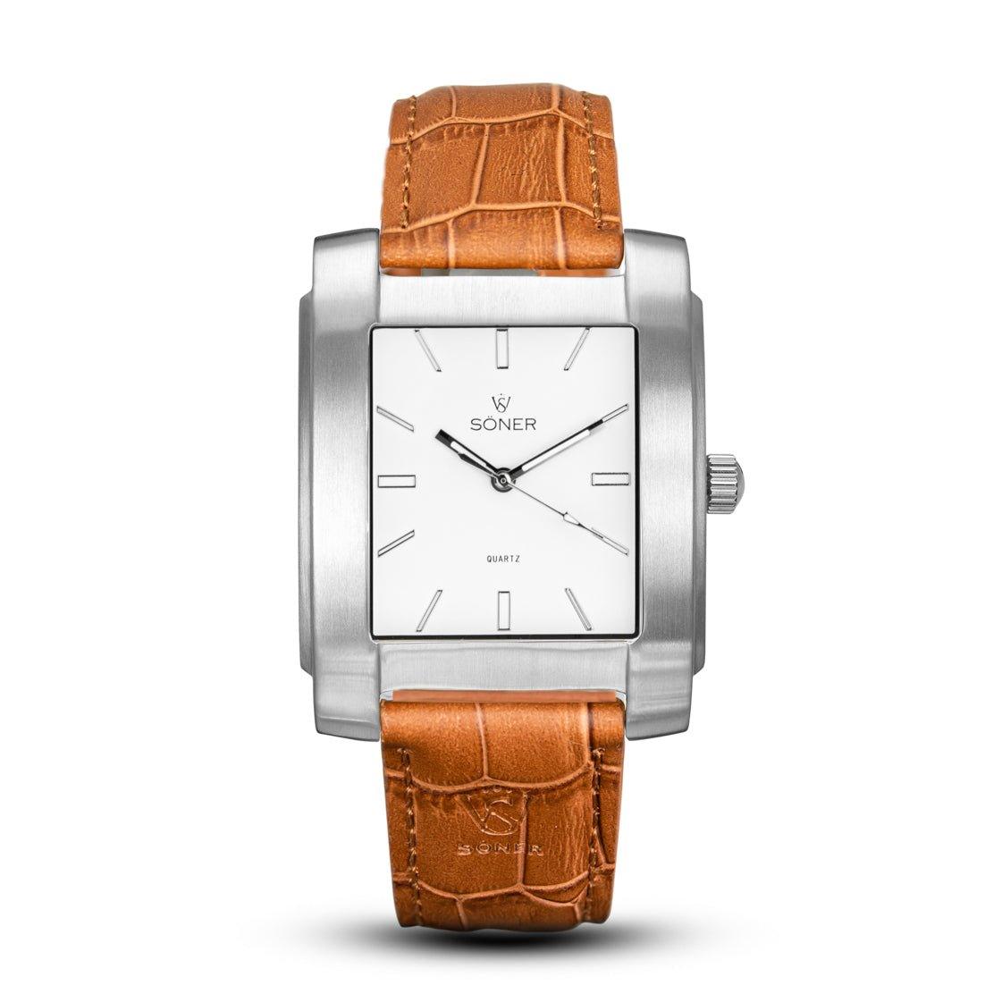 The Legacy Chaillot wristwatch from Söner features a silver metal rectangular case and a white dial with a minimalist design, showcasing black hour markers and hands. It is complemented by a brown textured leather strap with a crocodile pattern, and it comes with a 3-year battery.