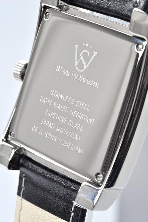 The image showcases the back of the Legacy Empire (3-year Battery) square watch from Söner by Sweden. The backplate features details such as stainless steel, 5ATM water resistance, sapphire glass, Japan movement, and CE & RoHS compliance. The strap is elegantly designed in black and white.