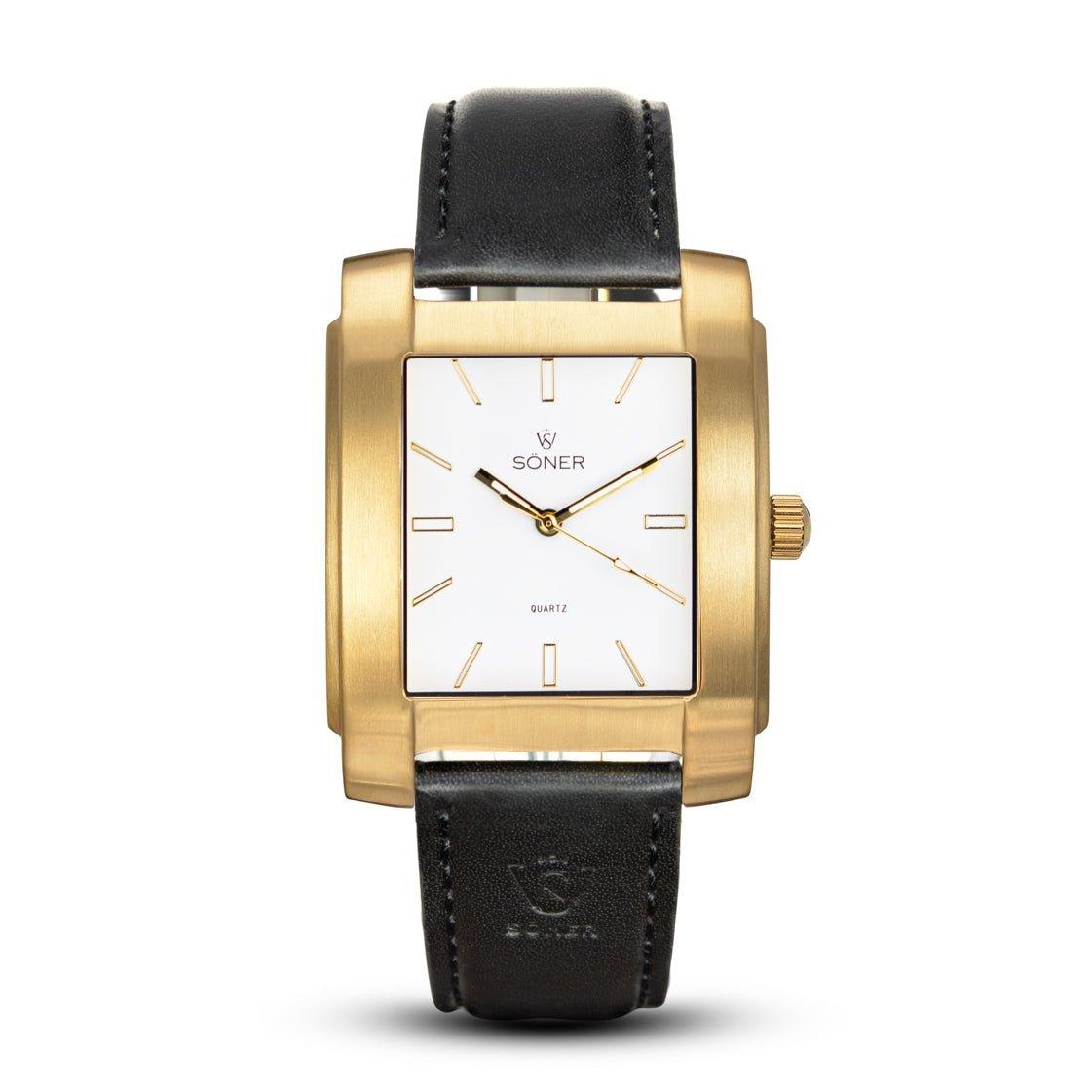 The Legacy Express showcases a rectangular watch with a white dial featuring a minimalist design and gold hour markers. This elegant timepiece prominently displays the Söner brand name on its face and is paired with a sleek black leather strap, offering a 3-year battery life.