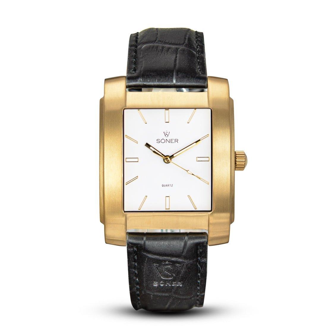 The Legacy Express (3-year Battery) from Söner is a gold rectangular wristwatch that features a white dial, minimalist hour markers, and a black leather strap. The brand name Soner adorns the dial, epitomizing elegance.