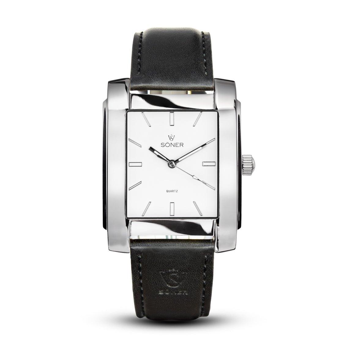 The Legacy Prisma (3-year Battery) wristwatch from Söner is an elegant piece featuring a rectangular silver case and a white dial with minimalist hour markers and sleek silver hands. The black leather strap adds a classic touch, perfectly complementing the stylish design that proudly displays the Söner brand name on the dial.