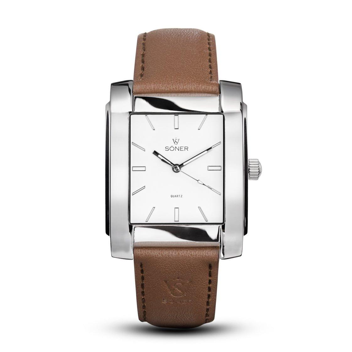 The Legacy Prisma rectangular watch from Söner showcases a sleek silver case, a white face with minimalist hour markers, and a brown leather strap. The brand name SONER is prominently displayed on the watch face, capturing elegance and sophistication in every glance. This model features a 3-year battery for lasting performance.