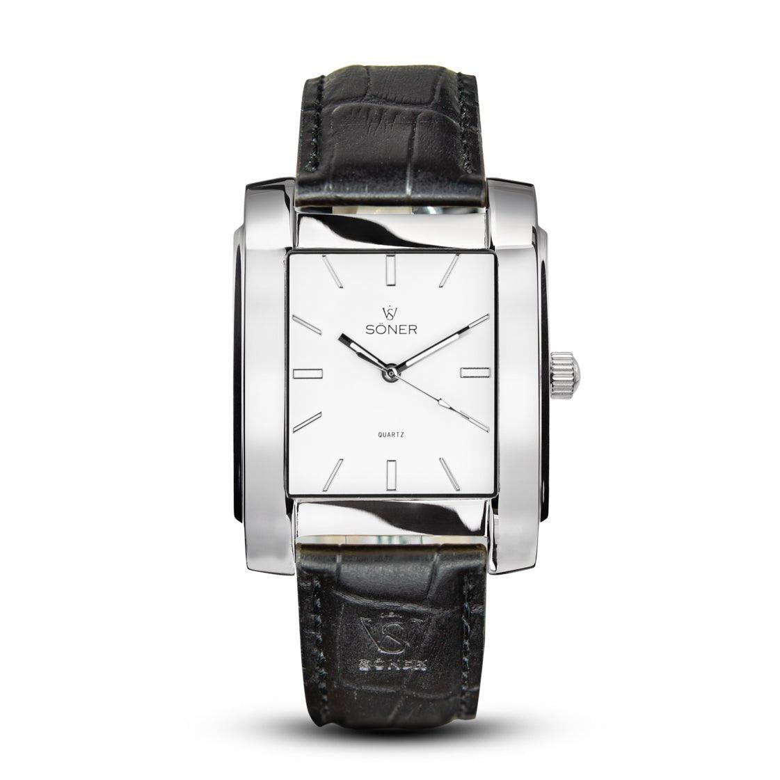 The Legacy Prisma by Söner is a sleek silver rectangular wristwatch, featuring a black leather strap and a white face with minimalist hour markers and two hands. It proudly displays the distinctive Soner brand name.