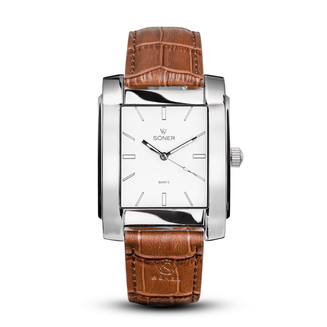 The Legacy Prisma, a rectangular wristwatch from Söner, boasts an elegant design with a white dial featuring minimalist hour markers and a brown leather strap. The brand name Soner and Quartz are prominently displayed on the dial.