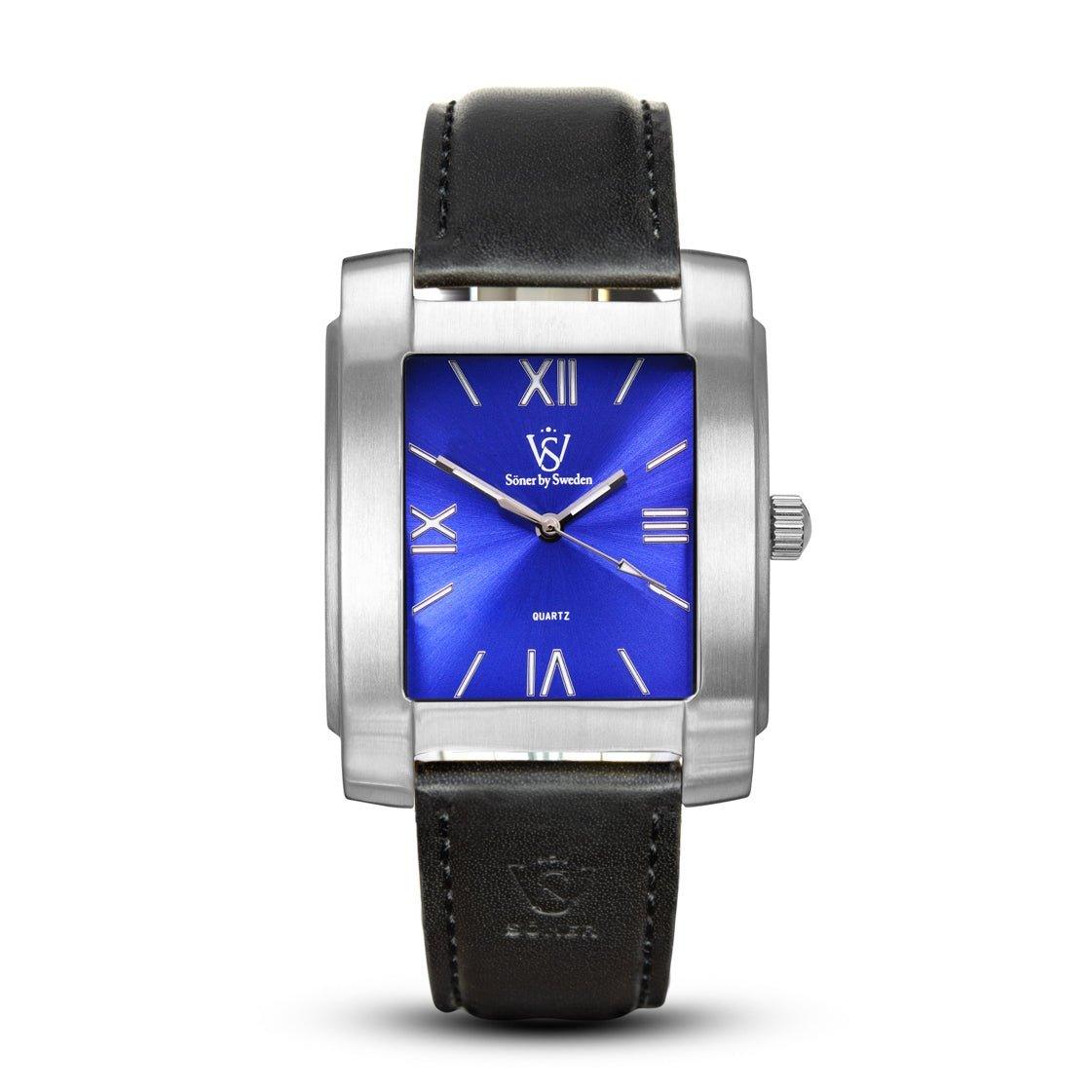 The Legacy Stoclet watch is a stylish rectangular timepiece featuring a silver case and vibrant blue dial adorned with Roman numerals. It boasts a black leather strap and displays the Söner logo on both the dial and the strap. Additionally, it comes with a 3-year battery life.