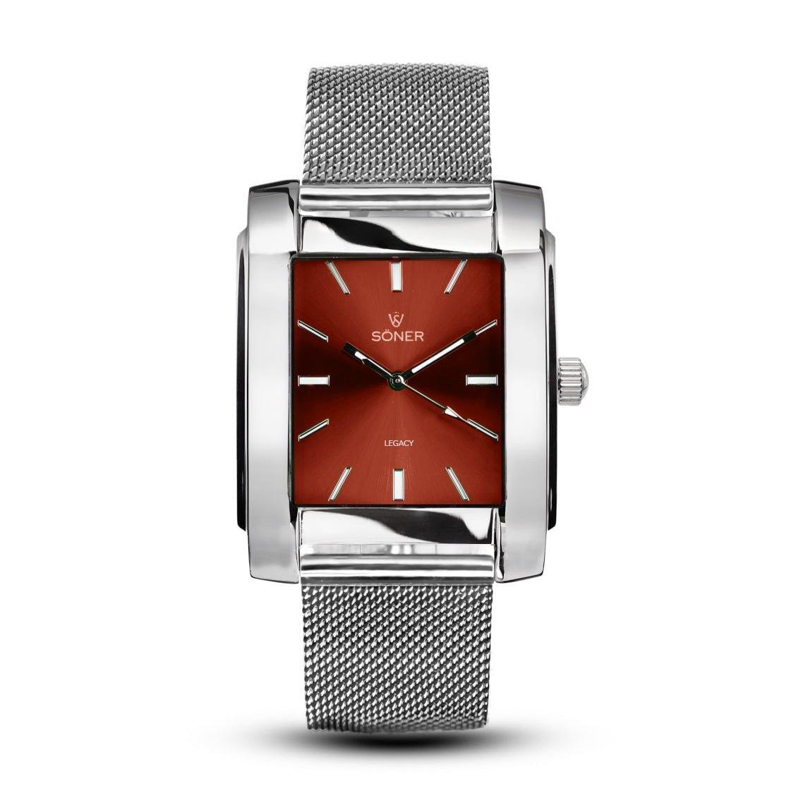 The Legacy Tribune rectangular silver watch from Söner boasts a sleek mesh band and an eye-catching red dial. Its minimalist hour markers and two hands elegantly complement the brand's name and logo displayed at the center, all while offering a 3-year battery life.