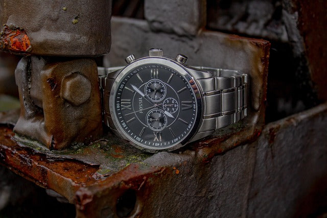 luxury-silver-watch-on-rust-metal