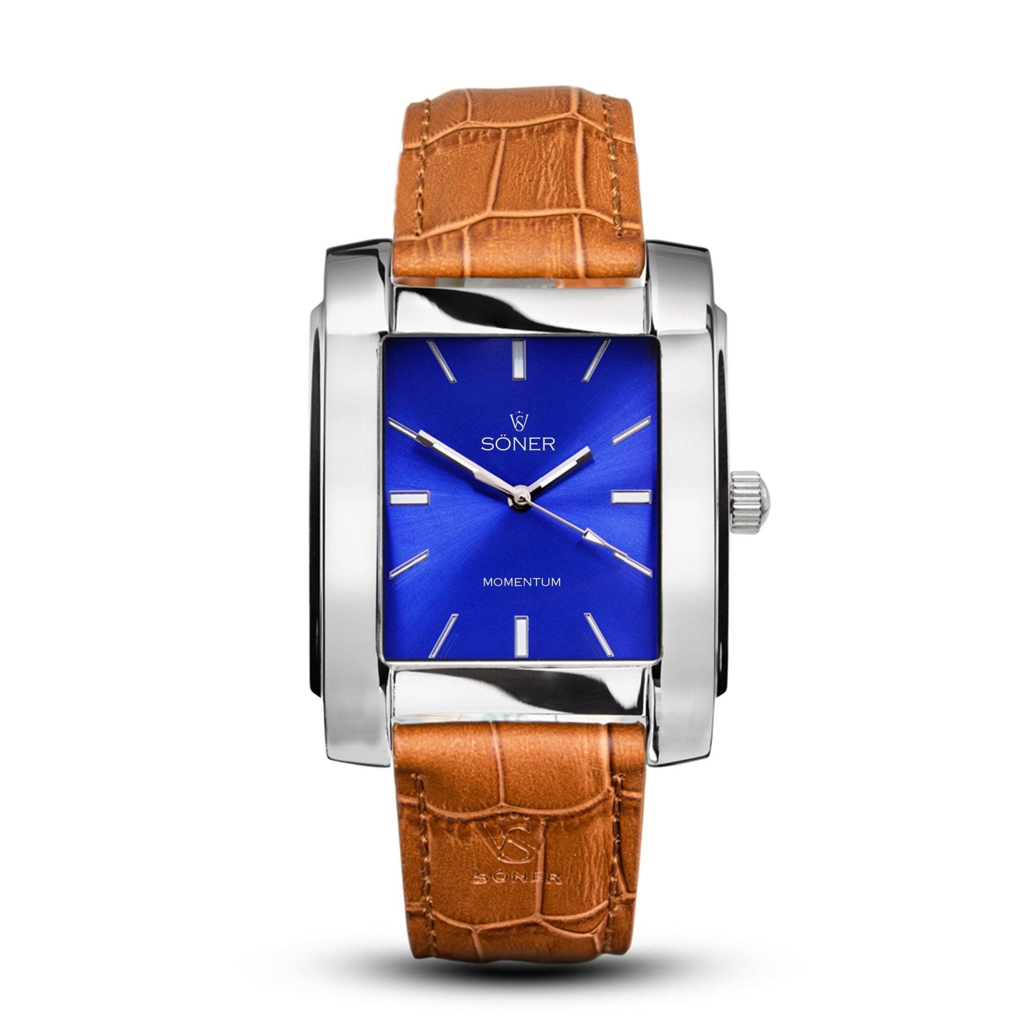 Introducing the Momentum Bacardi: a luxurious rectangular watch featuring a silver metal case, vibrant blue dial, and minimalist hour markers. It’s elegantly paired with a brown textured leather strap secured by a buckle. The prestigious Söner brand name and the word "Momentum" are gracefully showcased on the dial. (Self-winding)