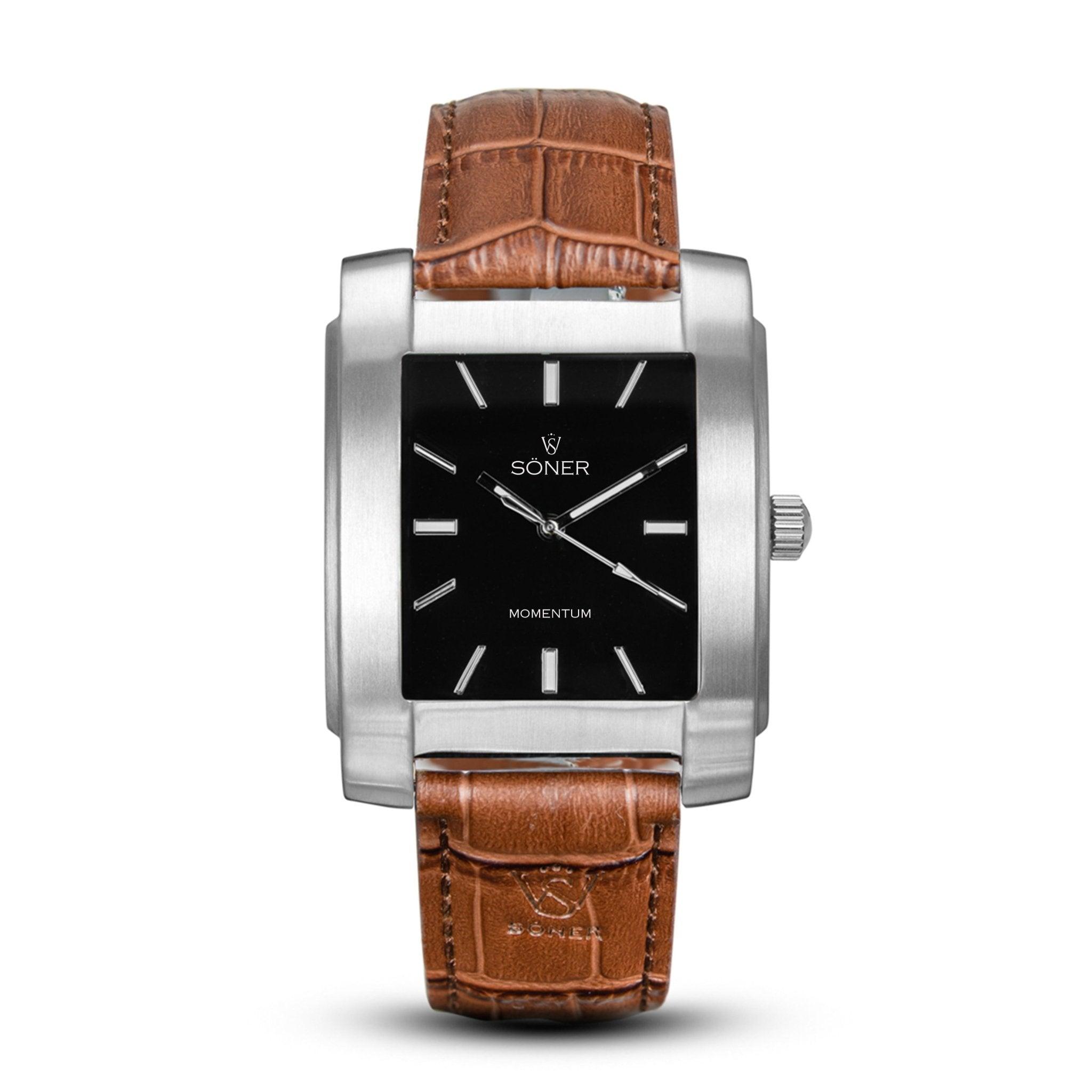 Introducing the Momentum Eden (Self-winding): a silver rectangular watch featuring a black face with minimalistic white markings. It comes with a brown leather strap accentuated by visible stitching, and the brand name Söner along with Momentum is elegantly displayed on the watch face, perfectly capturing a blend of timeless design and modern sophistication.