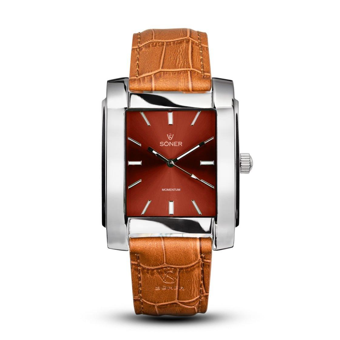 The Momentum Rhodes (Self-winding) watch from Söner showcases a rectangular design with a red face, encased in a silver frame and adorned with minimalist hour markers. Its tan leather strap boasts an elegant crocodile pattern, while the Soner brand name enhances the classic elegance of this square timepiece.