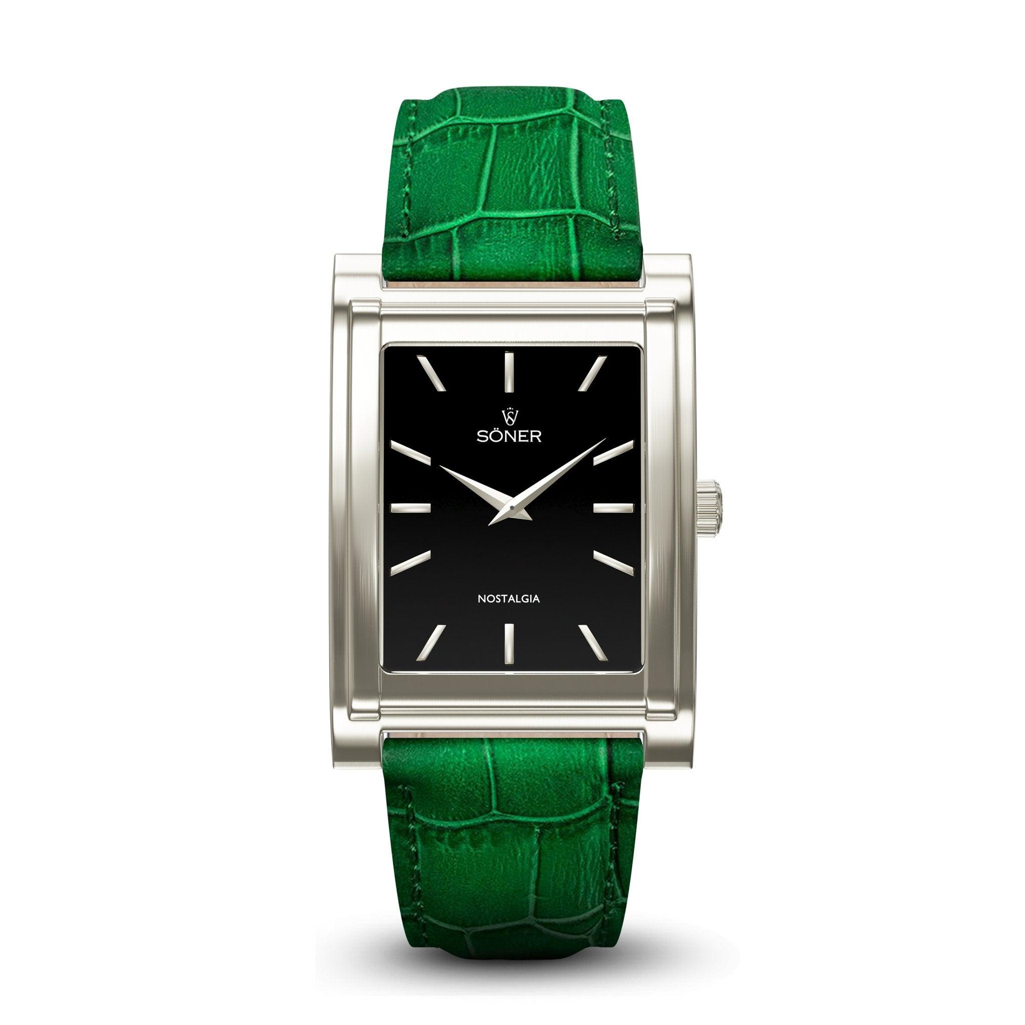 The Nostalgia London watch features a rectangular design with a black face and silver frame, highlighted by minimalist lines and the branding "SONER" at the top. It is complemented by a striking, vibrant green crocodile-patterned leather strap.