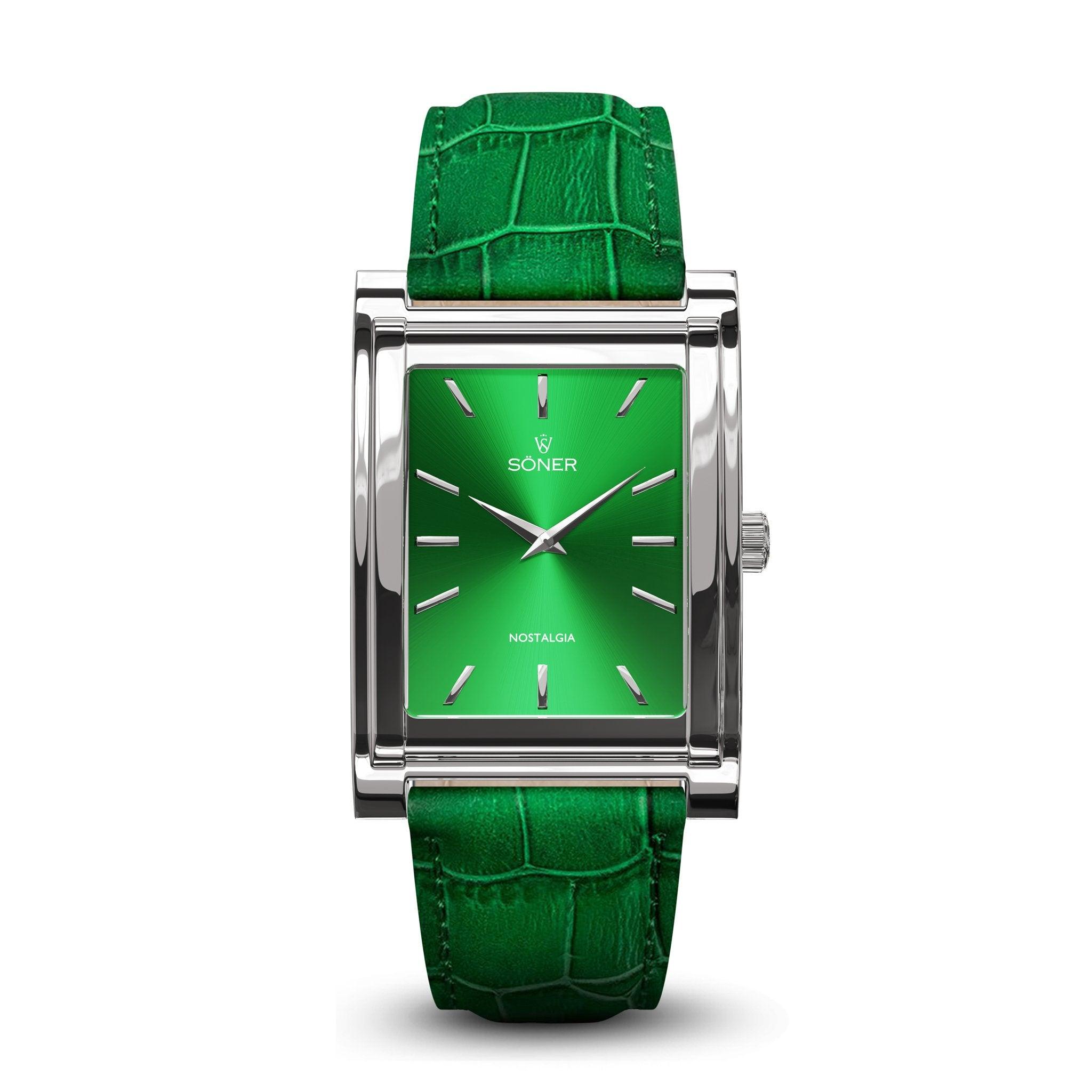 The Nostalgia New York (11-year Battery) features a rectangular silver wristwatch design with a glossy green face, minimalist markers, and thin hands. It brings to mind the classic elegance of Söner's square watches. Completing its sleek and modern look is a matching green alligator leather strap.