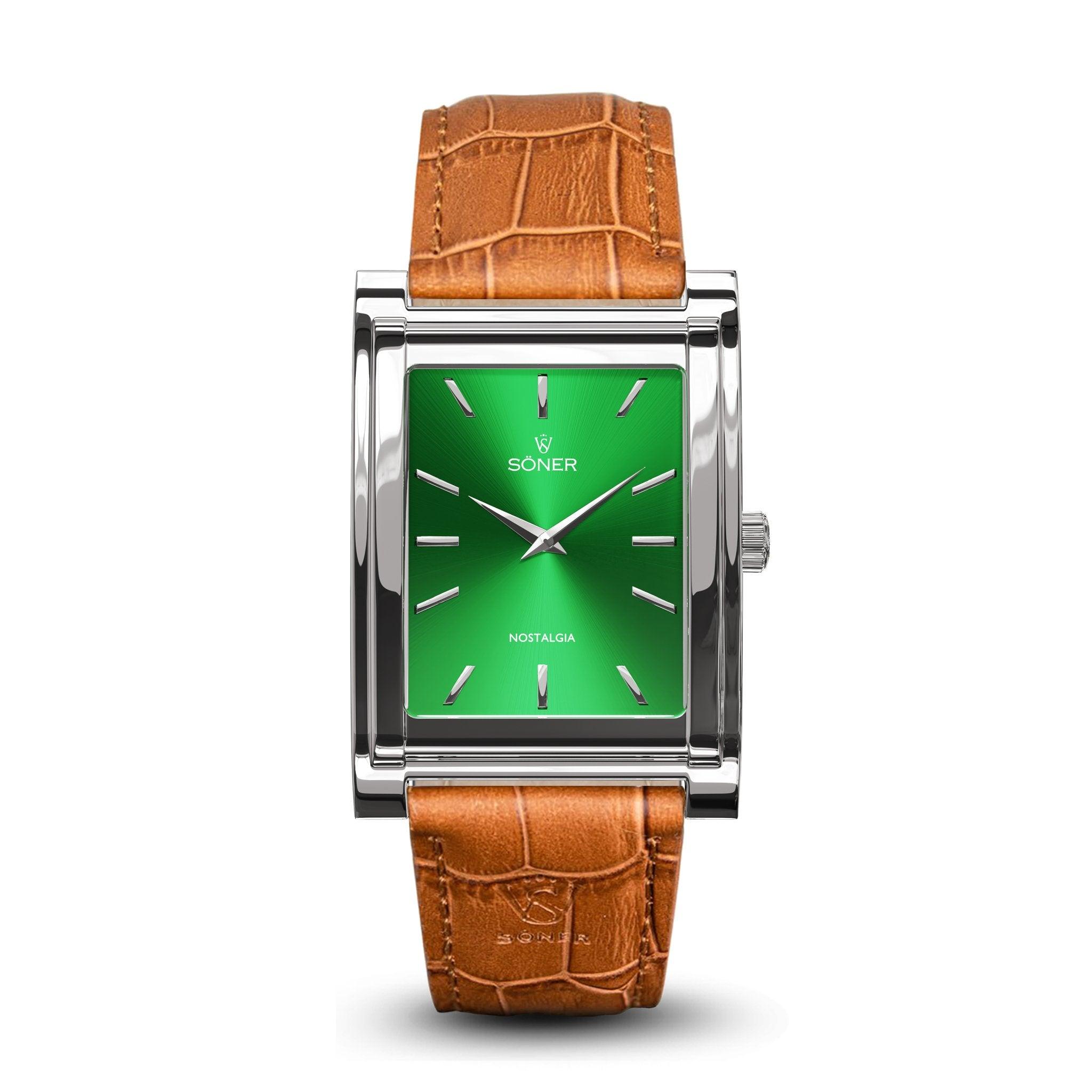 Introducing the Nostalgia New York, a rectangular watch with a vibrant green dial adorned with silver hour markers and hands. It features a polished silver-tone case complemented by a brown leather strap with an elegant crocodile pattern. The brand name Soner and Nostalgia grace the dial, embodying timeless elegance from Söner. Plus, it comes with an impressive 11-year battery life.