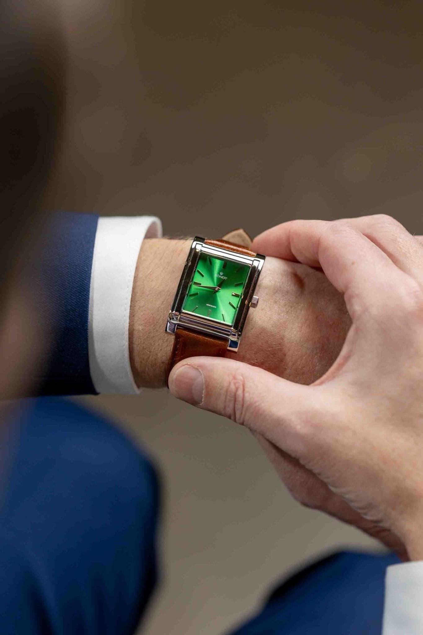 Square watch, Nostalgia New York with green dial - on male wrist checking the time