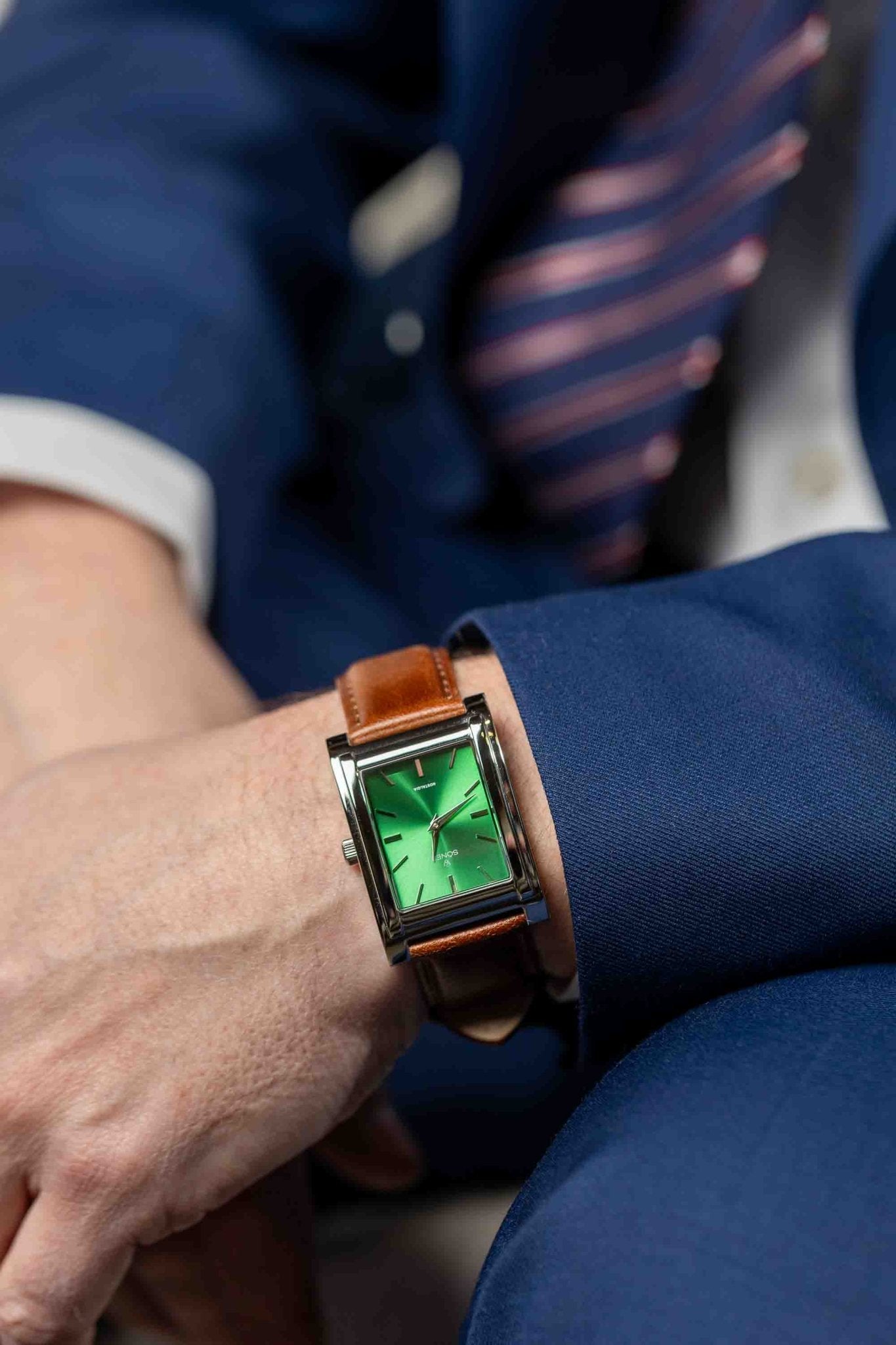 Square watch, Nostalgia New York with green dial - on male wrist close up