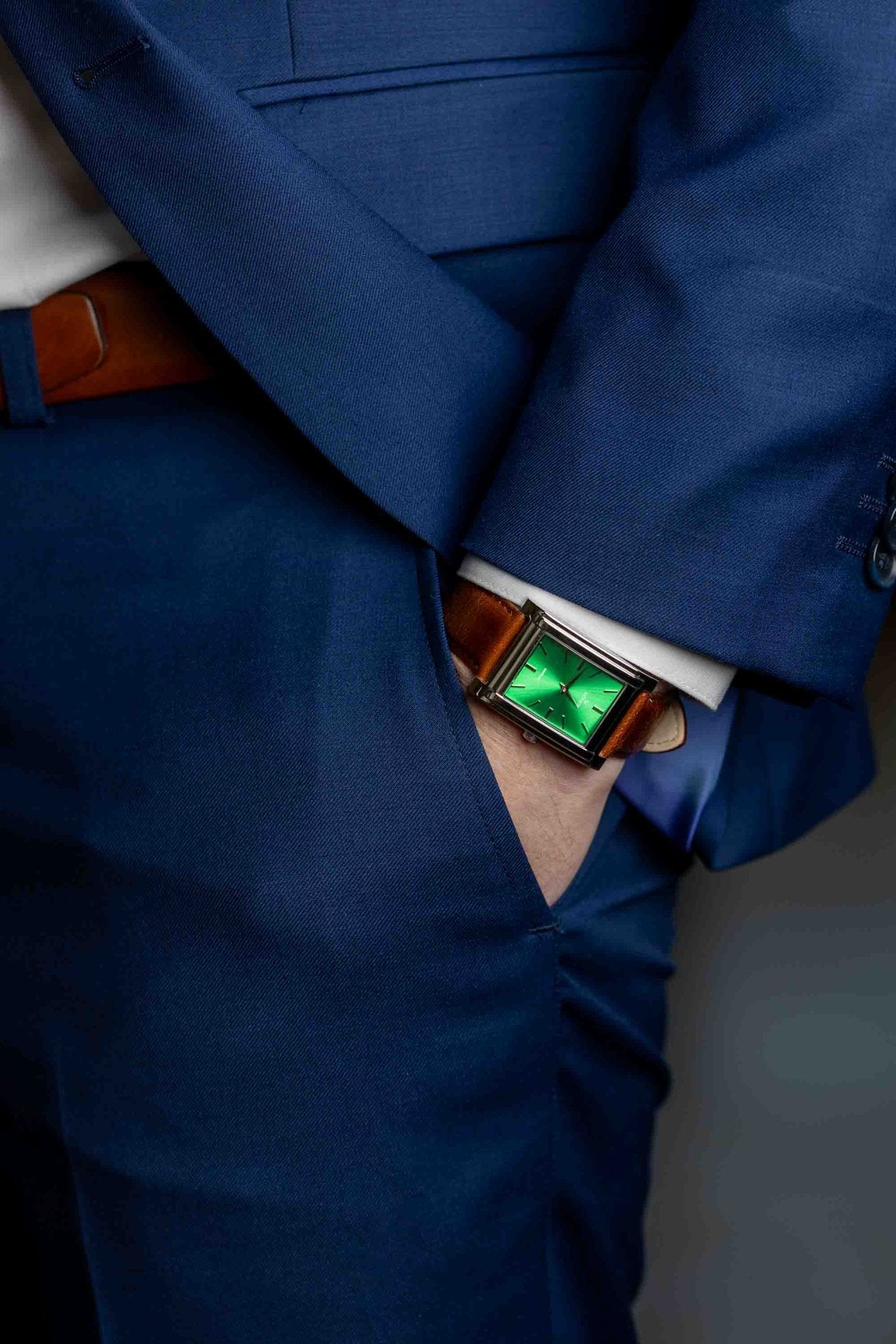 Square watch, Nostalgia New York with green dial - on male wrist with hand in pocket