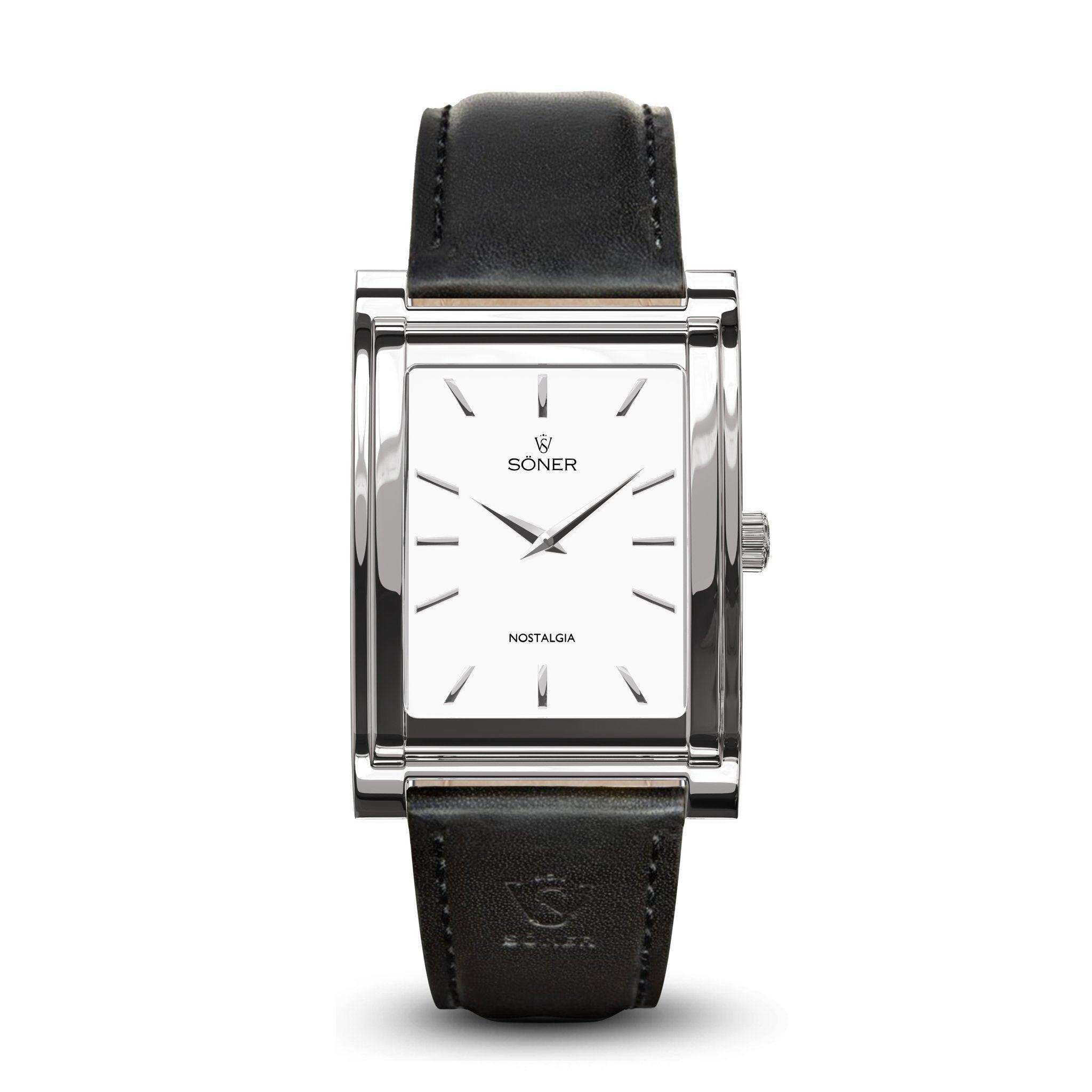 The Nostalgia Paris features a rectangular wristwatch design with a silver frame, white face, and slender black markers. It includes a crown on the right side and is adorned with the SONER and NOSTALGIA text on the dial. The watch is complemented by a black leather strap with a subtle embossed logo, making it an enduring classic from Söner. Plus, it boasts an impressive 11-year battery life.