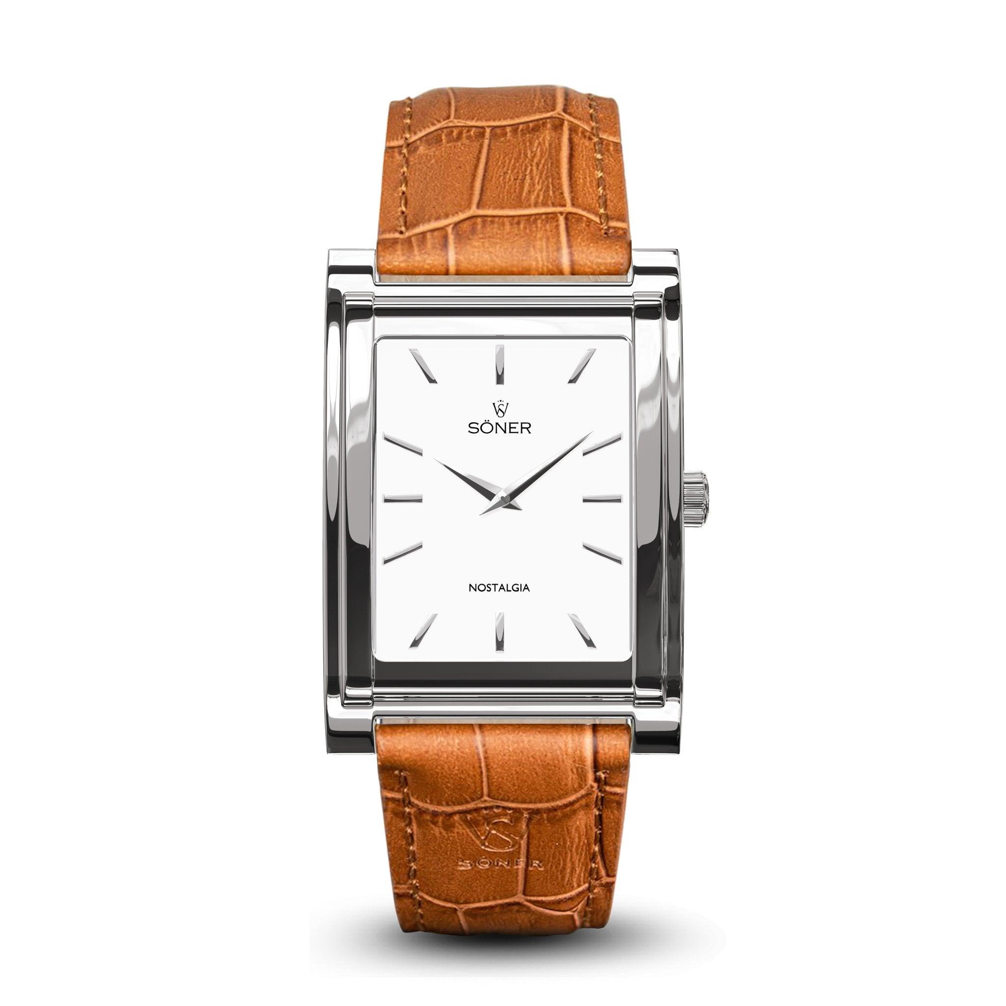 The rectangular wristwatch features a silver frame and a white face with minimalist hour markers and two hands. It is elegantly completed with a light brown, textured leather strap and is branded with "Nostalgia Paris" on its face, offering an impressive 11-year battery life.