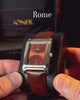 Rome, a rectangular watch in polished steel with a red dial vid