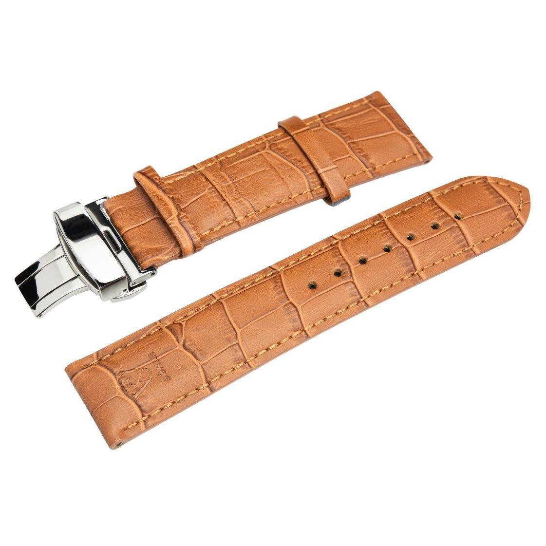 The HERITAGE Cognac Croc (22mm) is a brown leather watch strap with a crocodile pattern, featuring a silver clasp. It is laid out flat with visible holes for adjustment.